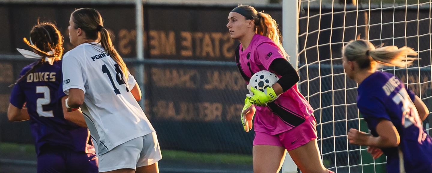 A Penn State goalkeeper claims the ball cleanly in a crowded six-yard box
