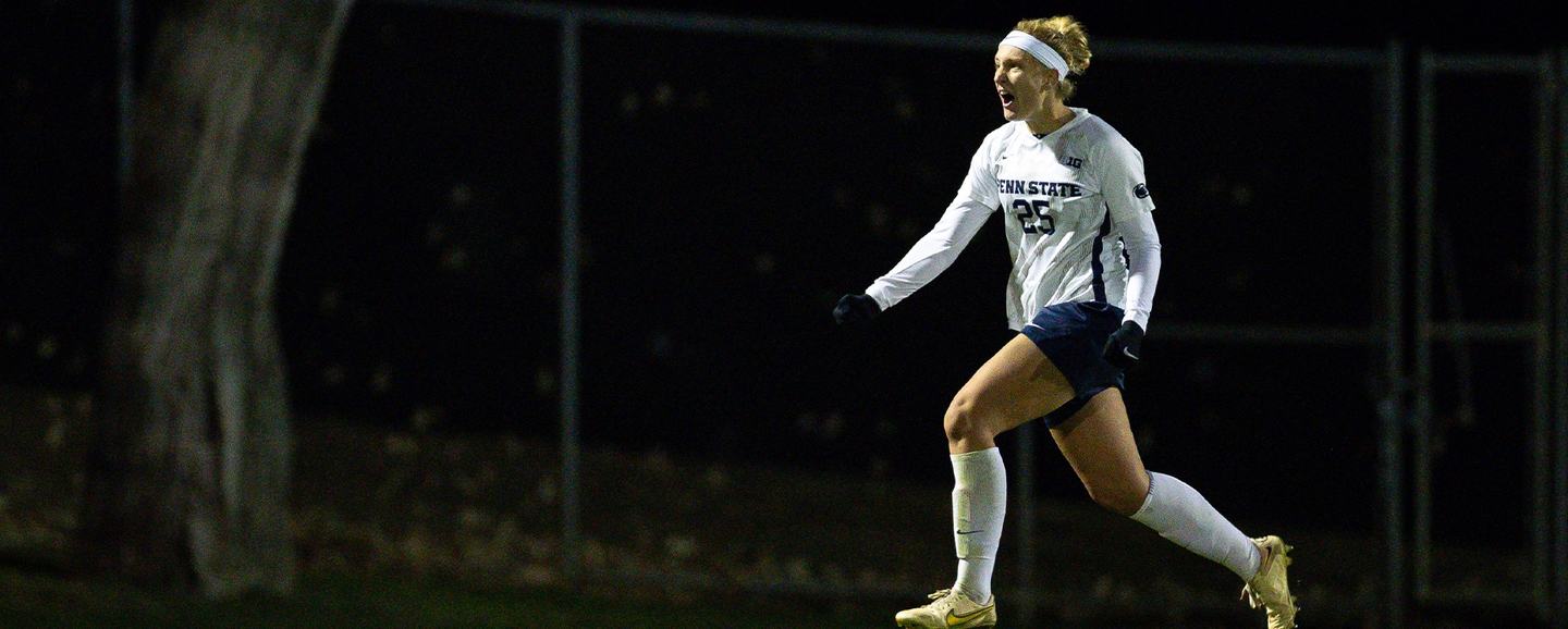 A Penn State player strides out in celebration under the Jeffrey Field lights